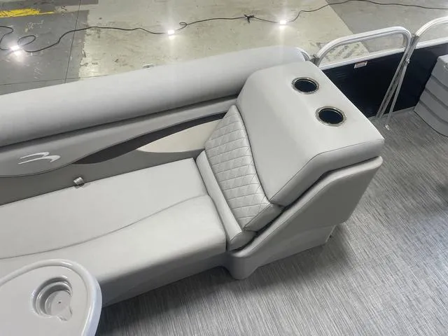 Slide: The Image of 2023 Bennington 20 SVF boat interior with gray seating and cup holders. - 19