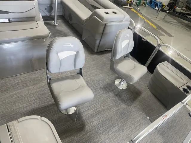 Slide: The Image of 2023 Bennington 20 SVF pontoon boat interior with gray seating and flooring. - 27