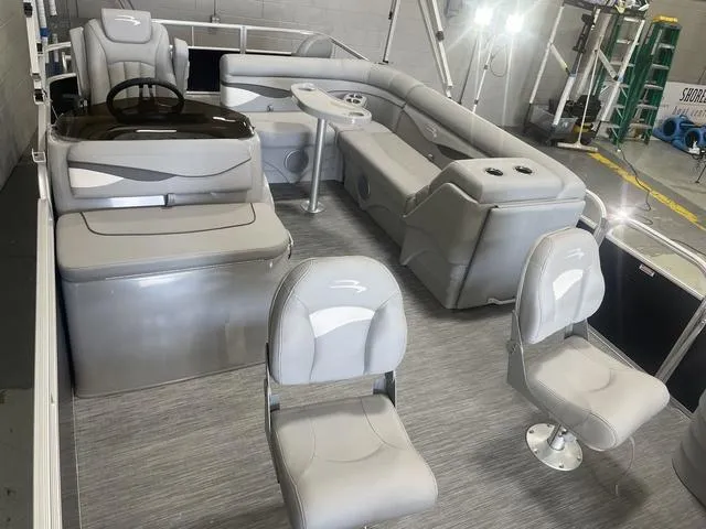 Slide: The Image of 2023 Bennington 20 SVF pontoon boat interior with gray seating and modern design. - 28