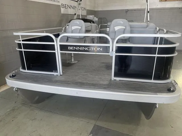 Slide: The Image of 2023 Bennington 20 SVF pontoon boat with gray seating and sleek design in showroom. - 29