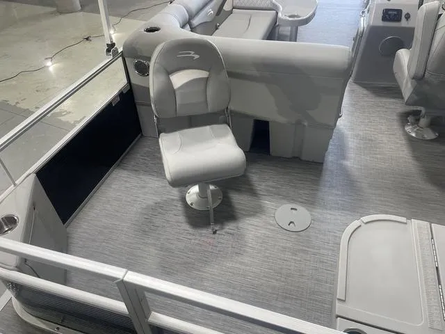 Slide: The Image of 2023 Bennington 20 SVF pontoon boat interior with gray seating and flooring. - 5