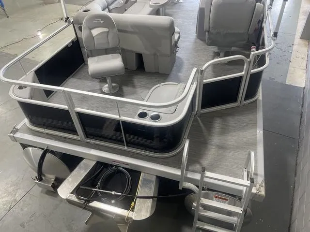 Slide: The Image of 2023 Bennington 20 SVF pontoon boat interior with seating and railing, viewed from above. - 7