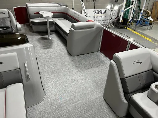 Slide: The Image of 2023 Bennington 24 SXL pontoon boat interior with gray seating and modern design. - 20