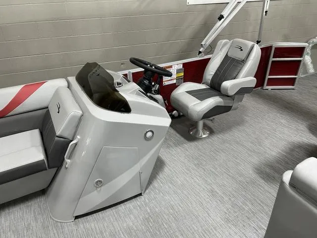 Slide: The Image of 2023 Bennington 24 SXL boat interior with modern helm and seating. - 22