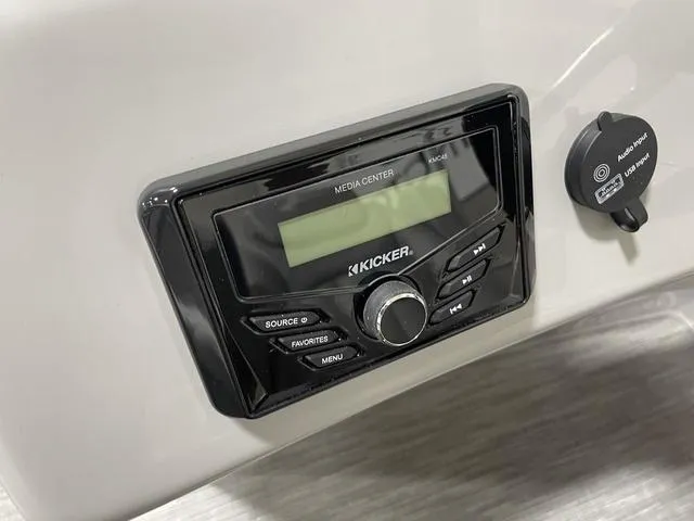 Slide: The Image of 2023 Bennington 20 SVL media center with Kicker audio system and USB port. - 12