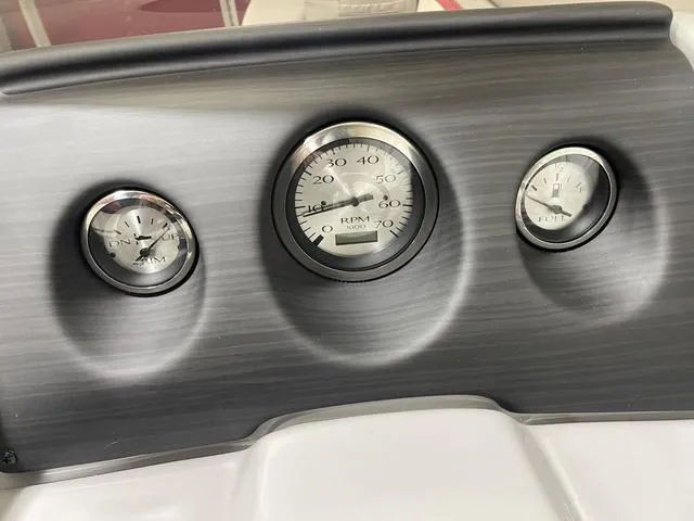 Slide: The Image of Dashboard of 2023 Bennington 20 SVL boat with RPM and fuel gauges. - 14