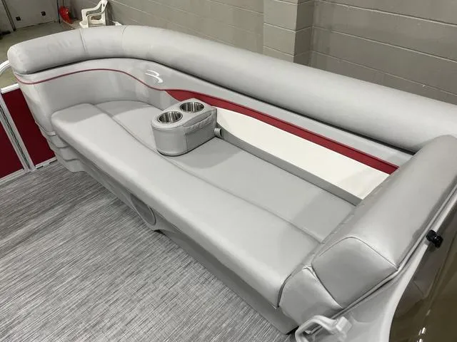 Slide: The Image of 2023 Bennington 20 SVL boat interior with gray seating and cup holders. - 17