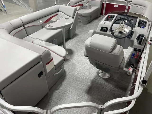 Slide: The Image of 2023 Bennington 20 SVL pontoon boat interior with plush seating and modern helm. - 7