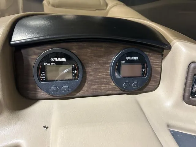 Slide: The Image of Dashboard of a 2016 Bennington 2550 GSR with Yamaha gauges for speed and fuel. - 14