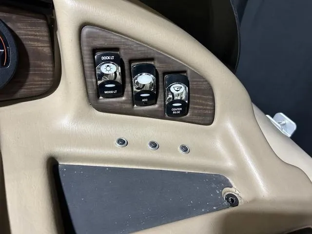 Slide: The Image of Control panel of a 2016 Bennington 2550 GSR boat with switches for dock and mood lighting. - 19