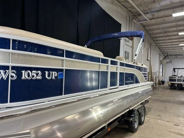 Slide: The Image of 2016 Bennington 2550 GSR pontoon boat on trailer in indoor storage facility. - 3