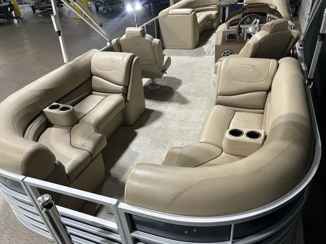 Slide: The Image of Luxurious interior of a 2016 Bennington 2550 GSR pontoon boat with beige seating. - 6