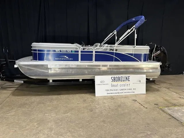 Slide: The Image of 2022 Bennington 22 SVSR pontoon boat displayed at Shoreline Boat Center. - 1
