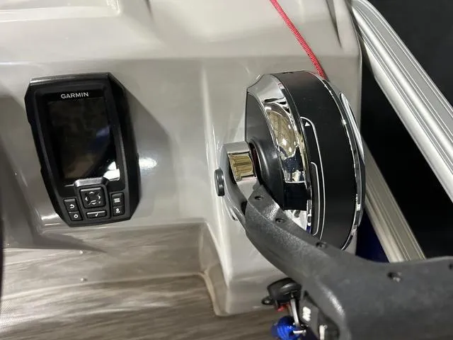 Slide: The Image of Control panel of 2022 Bennington 22 SVSR with Garmin device and throttle lever. - 15