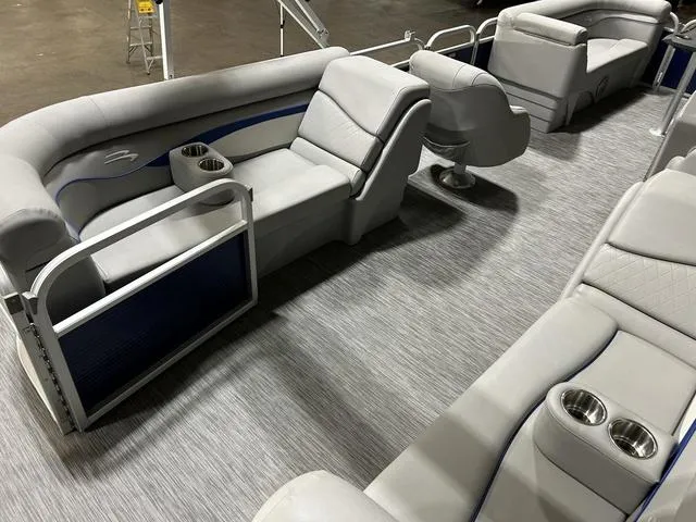 Slide: The Image of 2022 Bennington 22 SVSR pontoon boat interior with gray seating and cup holders. - 17