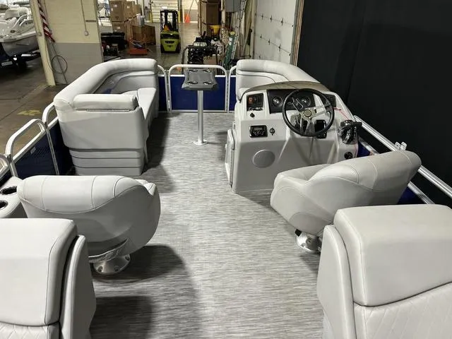 Slide: The Image of 2022 Bennington 22 SVSR pontoon boat interior with plush seating and modern helm. - 19