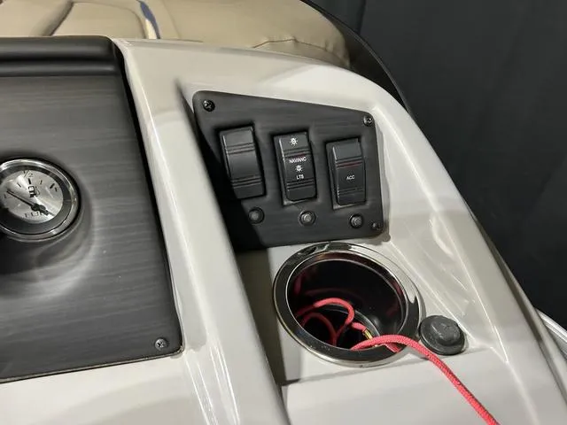 Slide: The Image of Control panel of 2022 Bennington 22 SVSR boat with switches and cup holder. - 20