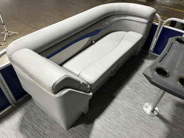 Slide: The Image of 2022 Bennington 22 SVSR pontoon boat interior with gray seating and cup holders. - 24