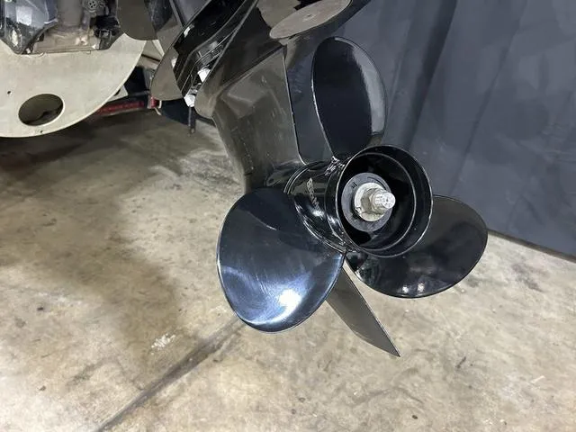 Slide: The Image of 2022 Bennington 22 SVSR boat propeller on concrete floor, close-up view. - 7