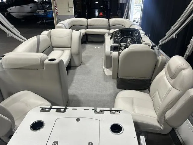 Slide: The Image of 2018 Sylvan 8522 Party Fish pontoon boat interior with plush seating and modern helm. - 10