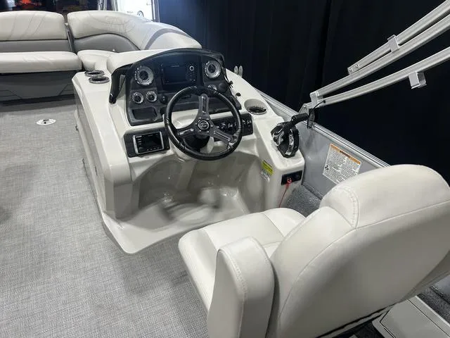 Slide: The Image of 2018 Sylvan 8522 Party Fish boat interior with steering console and seating. - 11