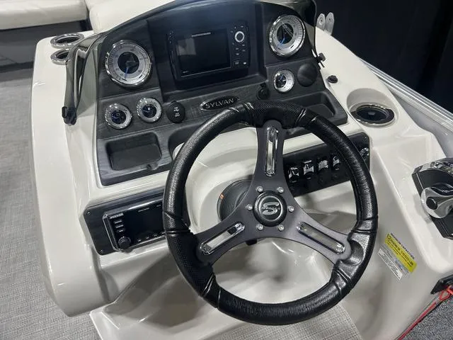 Slide: The Image of Steering console of 2018 Sylvan 8522 Party Fish boat with modern controls and gauges. - 12