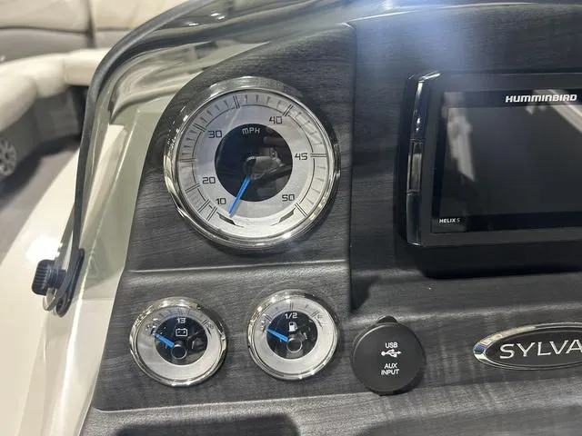 Slide: The Image of Dashboard of 2018 Sylvan 8522 Party Fish boat with gauges and Humminbird display. - 15
