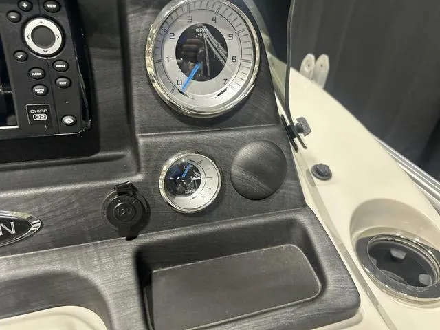 Slide: The Image of Dashboard of a 2018 Sylvan 8522 Party Fish boat with gauges and controls. - 17