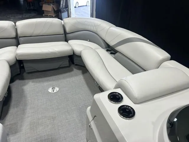 Slide: The Image of 2018 Sylvan 8522 Party Fish boat interior with plush seating and cup holders. - 20