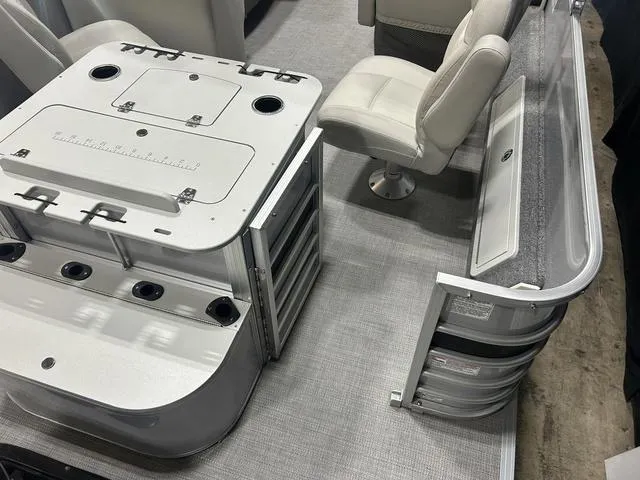 Slide: The Image of 2018 Sylvan 8522 Party Fish boat interior with seating and storage compartments. - 25