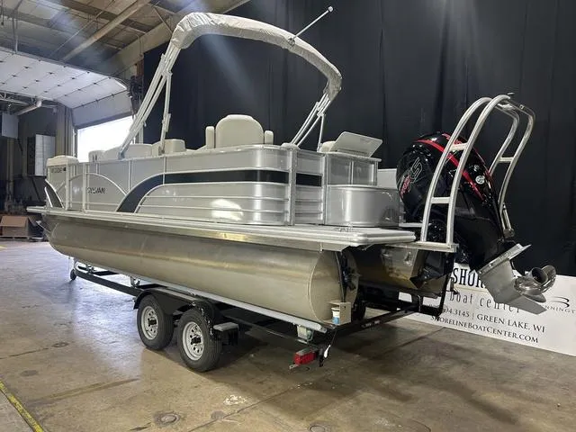 Slide: The Image of 2018 Sylvan 8522 Party Fish pontoon boat on trailer in indoor showroom. - 5