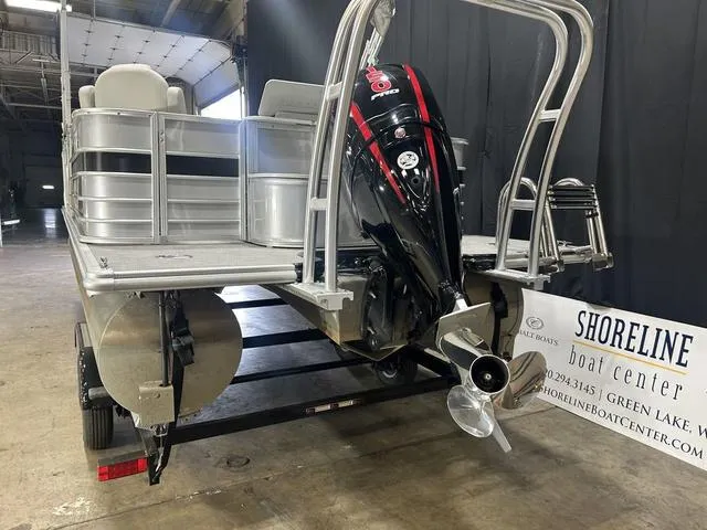 Slide: The Image of 2018 Sylvan 8522 Party Fish pontoon boat with outboard motor in a showroom. - 7