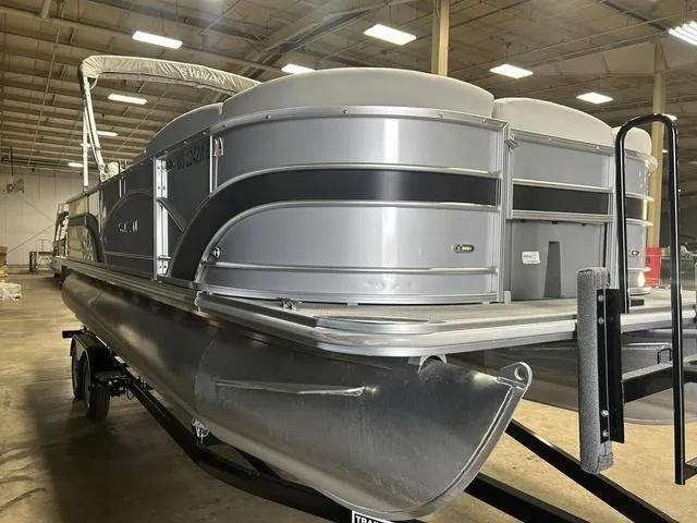 Slide: The Image of 2018 Sylvan 8522 Party Fish pontoon boat in a warehouse setting. - 8