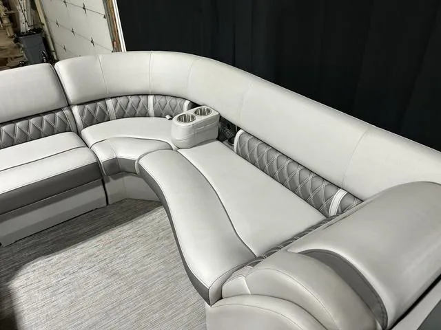 Slide: The Image of Luxurious seating on 2022 Bennington 24 LXSB pontoon boat with cup holders and quilted design. - 11