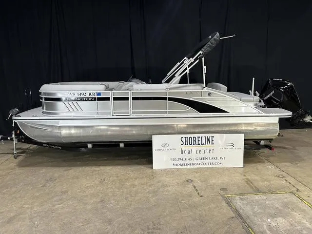 Slide: The Image of 2022 Bennington 24 LXSB pontoon boat displayed at Shoreline Boat Center. - 2