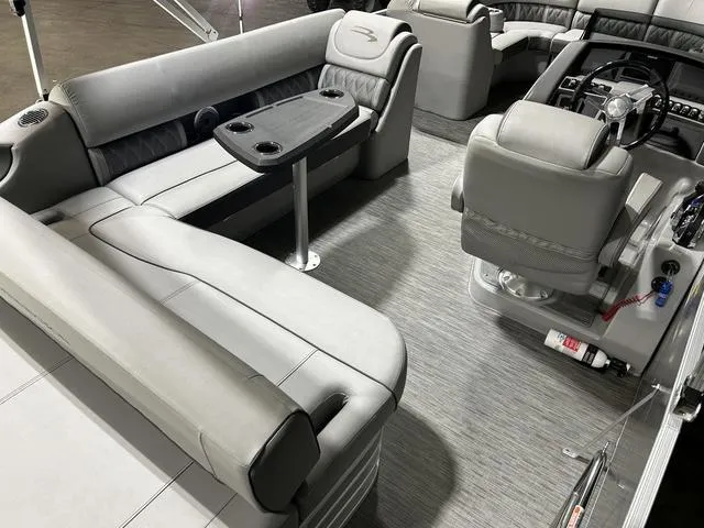 Slide: The Image of Luxurious interior of 2022 Bennington 24 LXSB pontoon boat with plush seating and sleek design. - 20