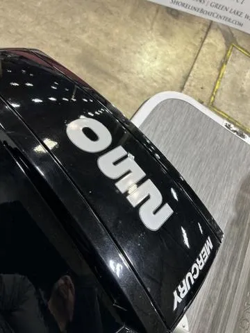 Slide: The Image of Mercury engine on 2022 Bennington 24 LXSB boat, displayed indoors. - 4