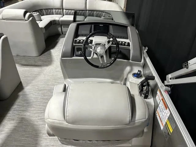 Slide: The Image of 2022 Bennington 24 LXSB boat interior with modern helm and plush seating. - 6