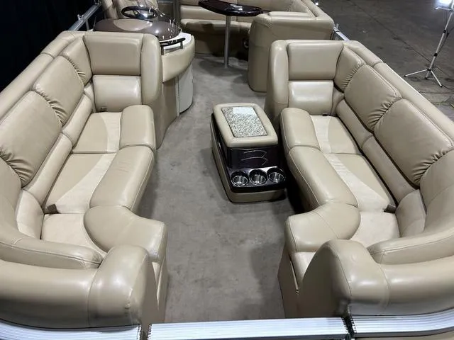 Slide: The Image of Luxurious 2007 Bennington 2275 QXI pontoon boat with plush beige seating and modern amenities. - 10
