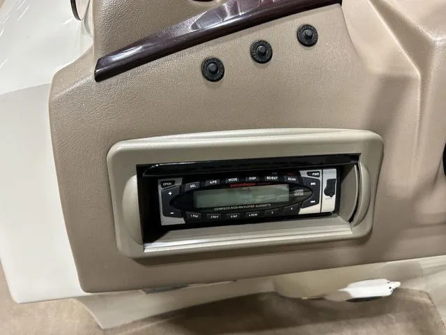 Slide: The Image of 2007 Bennington 2275 QXI dashboard with built-in stereo system and control panel. - 15