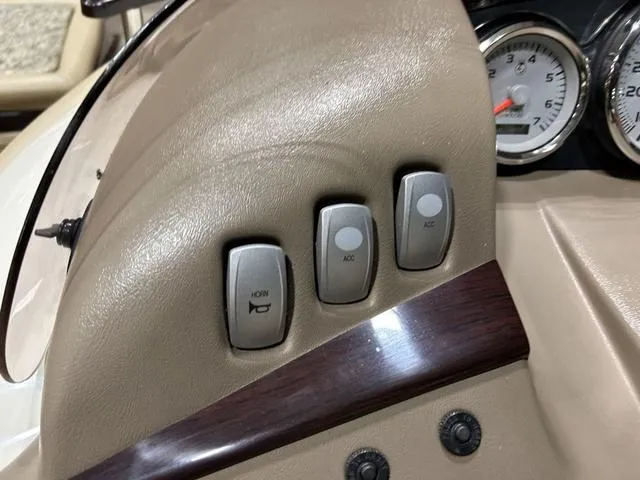 Slide: The Image of Dashboard controls of a 2007 Bennington 2275 QXI boat with switches and gauges. - 16