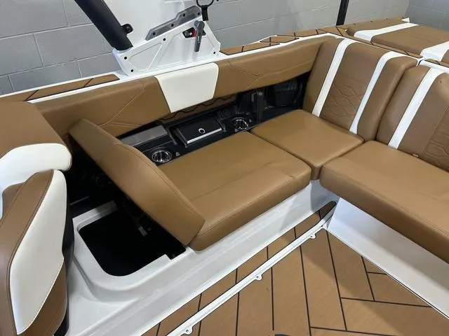 Slide: The Image of 2024 Malibu 23 LSV interior with tan and white seating, showcasing luxury and comfort. - 31