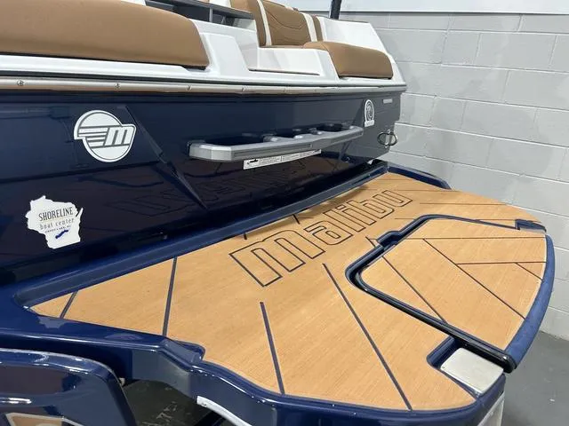 Slide: The Image of 2024 Malibu 23 LSV boat with teak swim platform and sleek design. - 6