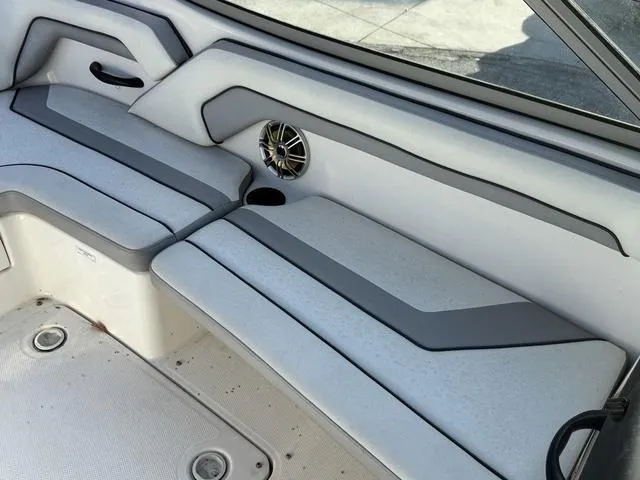 Slide: The Image of 2017 Yamaha Boats AR190 interior seating with speaker and cup holder. - 13