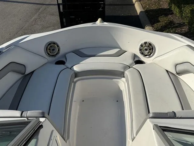 Slide: The Image of 2017 Yamaha Boats AR190 interior with cushioned seating and built-in speakers. - 16