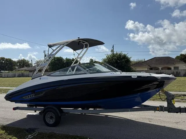 Slide: The Image of 2017 Yamaha AR190 boat on trailer, sleek design, blue and black color scheme. - 3