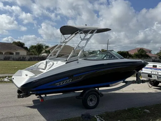 Slide: The Image of 2017 Yamaha AR190 boat on trailer under cloudy sky. - 8