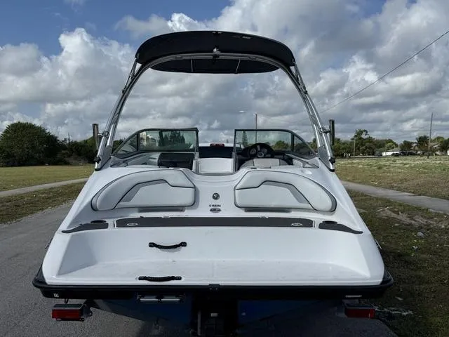 Slide: The Image of 2017 Yamaha AR190 boat, rear view, parked outdoors under cloudy sky. - 9