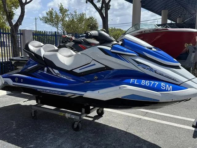 Slide: The Image of 2019 Yamaha WaveRunner FX Cruiser SVHO in blue and white, parked outdoors. - 3