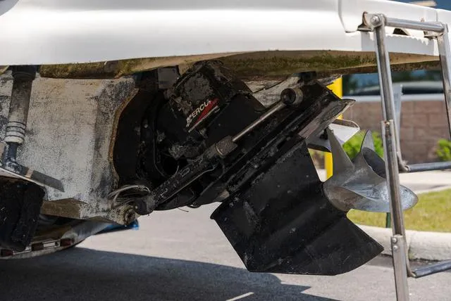 Slide: The Image of 2003 Sea Ray 240 Signature BR boat in indoor storage on a trailer. - 3